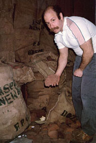 Mark Tinsky inspecting briar for American Smoking Pipe Co.